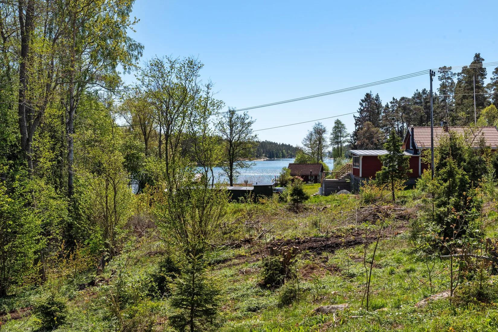 Tomt, Havsnära tomt som går ner till kanalen, Björkö, Norrtälje